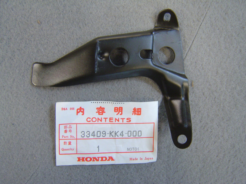 Support fixation clignotant avant droit Honda MBX125FE - 33409KK4000