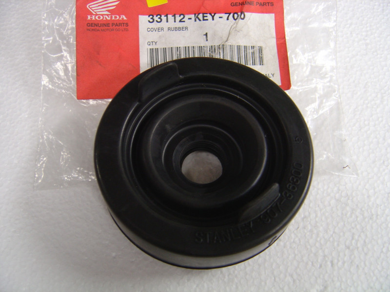 Caoutchouc montage phare Honda FES125 2000 - 33112-KEY-700