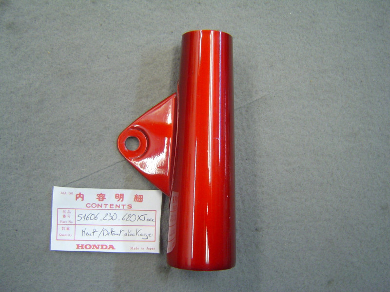 Support phare gauche Honda CD125 Ruby Red – Réf. 51606230620XJOCC