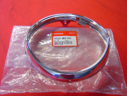 Cerclage de phare de CB600F 03-06 pièce neuve mais avec défauts de stockage