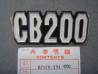 Emblème Cache Latéral Gauche Honda CB200 - Réf. 87126354000