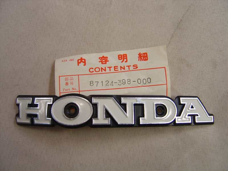 Logo réservoir gauche Honda CG110 - Réf. 87124398000