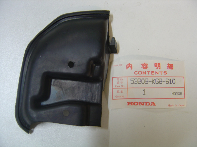 Caoutchouc support phare gauche Honda NH125 1984 - 53209KG8610