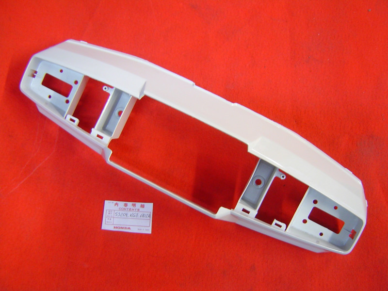 Capotage phare avant Honda NH125 1983 - Réf. 53204KG8610ZA