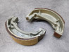 Jeu de machoires de frein TS125 TS50 RV90 SUZUKI 54401-35880