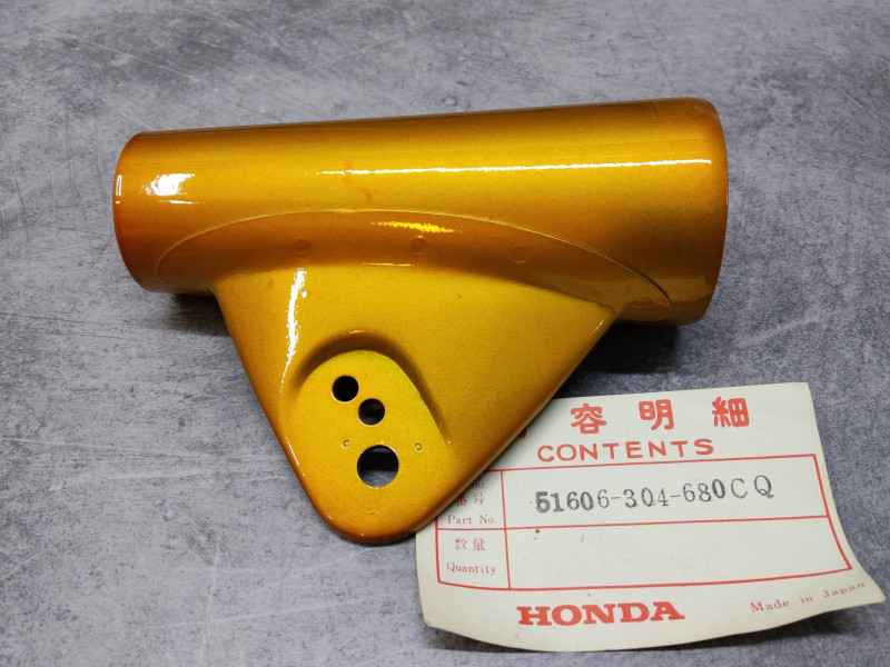 Patte de phare coté gauche couleur gold CB125K3 HONDA 51606-304-680CQ