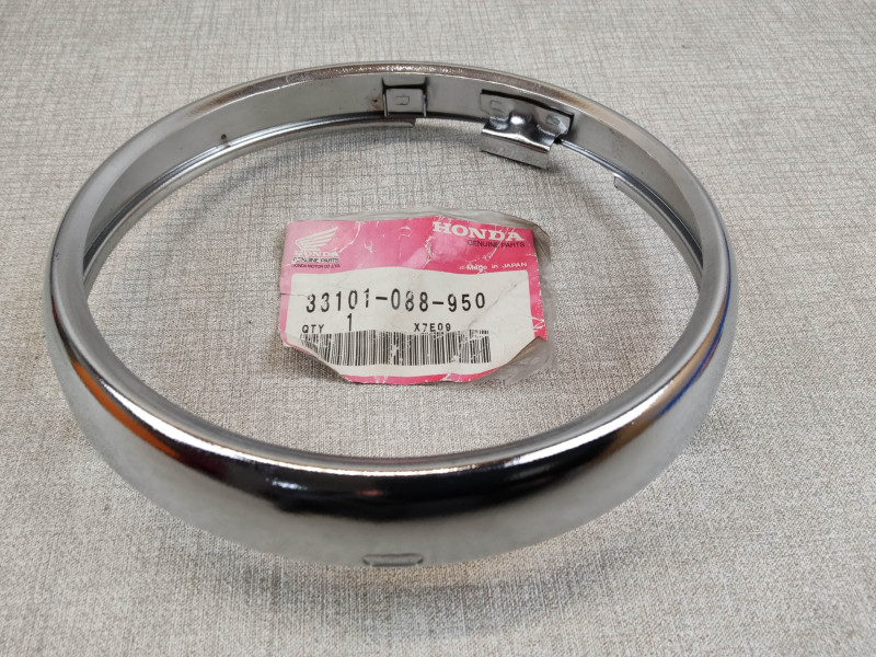 Cerclage de phare pour CG125 95/97 et SB50 1988 (J) neuf HONDA 33101-088-950